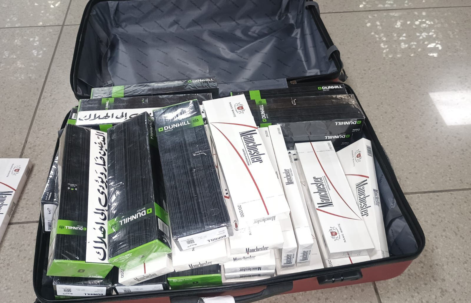 16,600 foreign cigarettes seized at Ahmedabad airport from two passengers arriving from Abu Dhabi