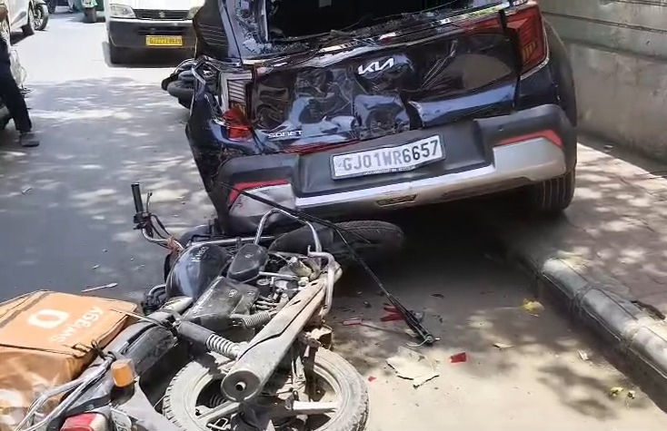 AMTS, Kia car, bike collision at Naranpura crossroads leaves 1 injured, causes traffic jam