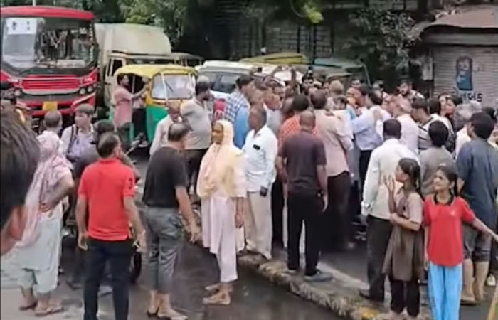 Fed up with frequent sewage overflow, Naroda residents block road
