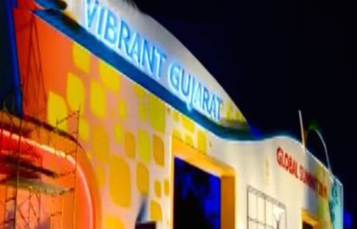 What picture do the investment figures paint for the Vibrant Gujarat Summit?