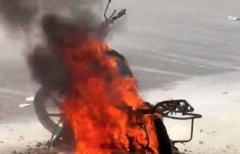Motorcycle catches fire on busy Anandnagar road in Ahmedabad, rider escapes unhurt