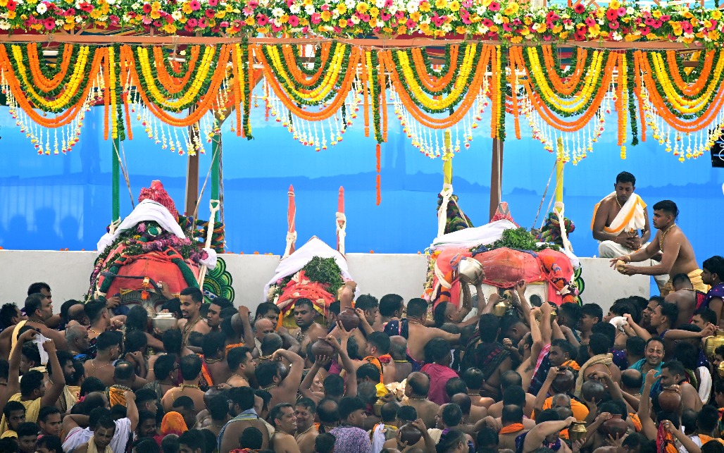 5 Priests perform rituals during the Snana Yatra of Lord Jagannath, Lord Balabhadra and Devi Subhadra at the Shree Jagannath Temple on the occasion of Deva S.jpg