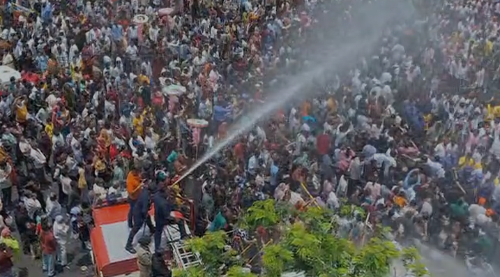 Fire Brigade showers water, bringing relief amid humid weather