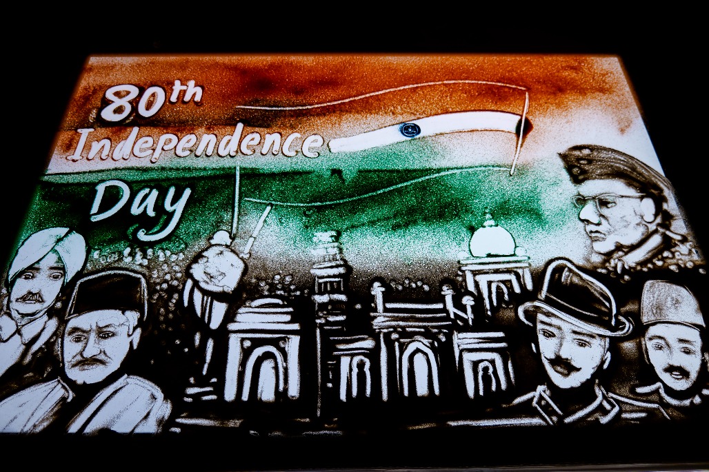 Puri - International sand artist Manas Kumar Sahoo creates a colourful sand artwork paying tribute to the freedom fighters on the eve of the 80th Independence Day, in Puri on Friday, August 14, 2026.jpg