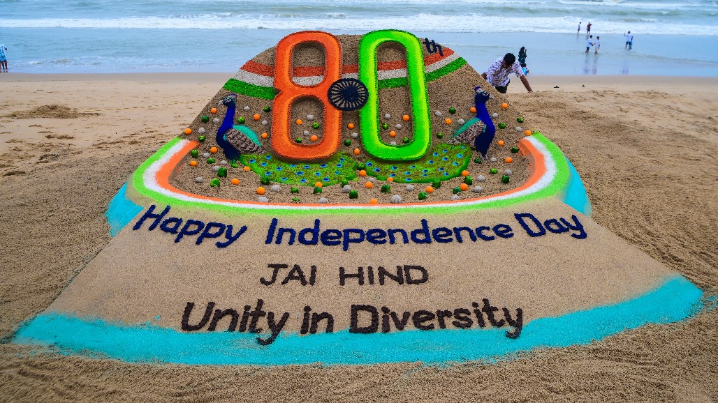 Puri - Sand artist Sudarsan Pattnaik creates a sand sculpture with the message ‘Happy Independence Day, Unity in Diversity’ at Puri Beach on the eve of India’s 80th Independence Day on Friday, August 14, 2026.jpg