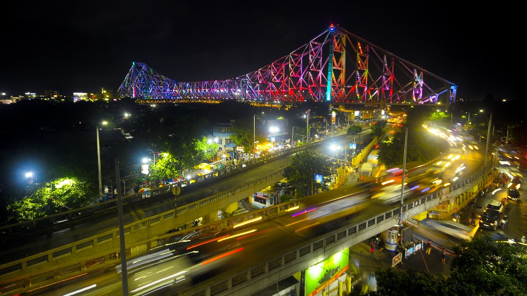 Kolkata - Vehicles pass across the illuminated Howrah Bridge ahead of the 80th Independence Day in Kolkata on Thursday, August 13, 2026.jpg