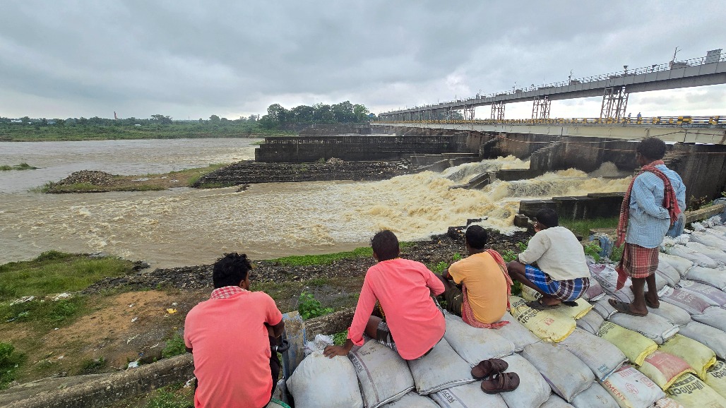 7West Bengal-Suri--- People watch water gushing out of the Tilpara Barrage as the water level in the Mayurakshi River rises in Suri, Birbhum district of West Bengal,.jpg