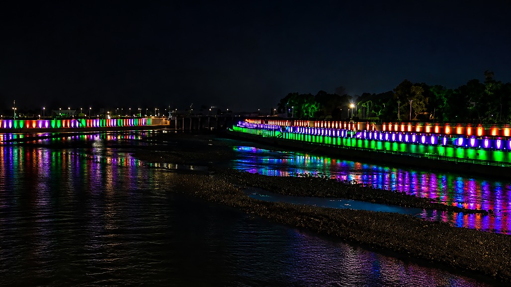 Jammu - A nighttime view of the River Tawi and its banks illuminated in the colours of the tri-colour on the eve of Independence Day celebrations on Friday, August 14, 2026.jpg