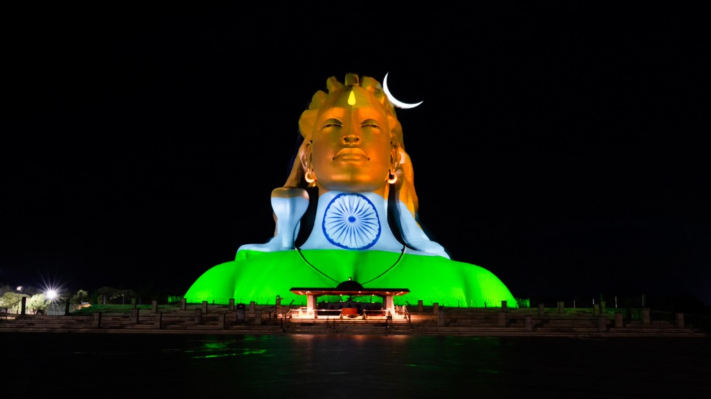 Coimbatore - The 112-foot Adiyogi statue at the Isha Yoga Center glows in hues of the Tricolour on the eve of India’s 80th Independence Day, in Coimbatore, Tamil Nadu, on Friday, August 14, 2026.jpg
